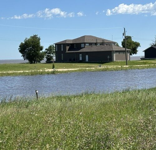 High and dry Lots 9 & 10. Lake in the background, canal in the front
